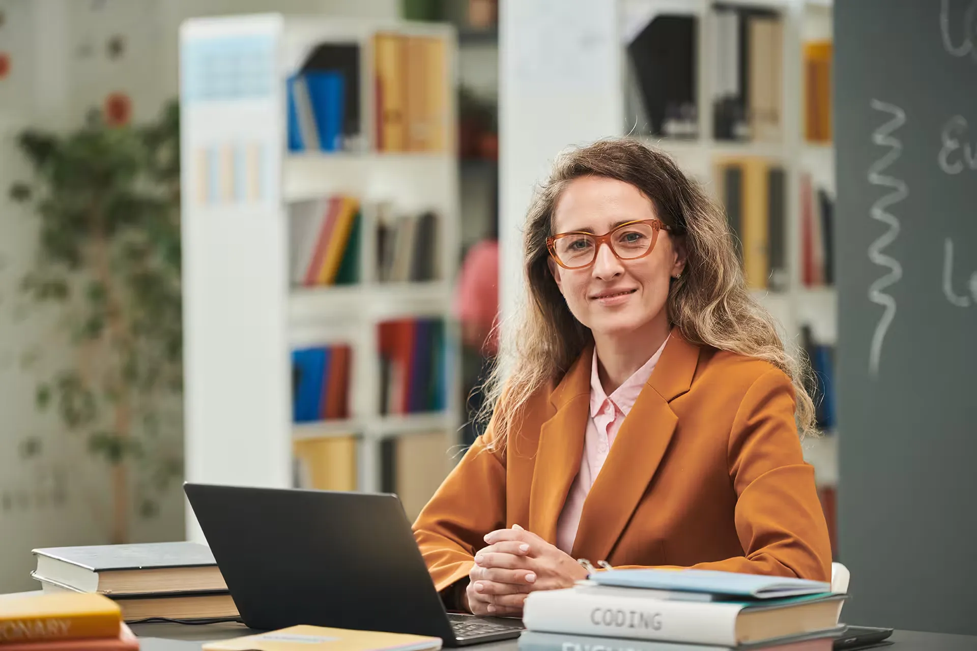 Teacher smiling at her desk